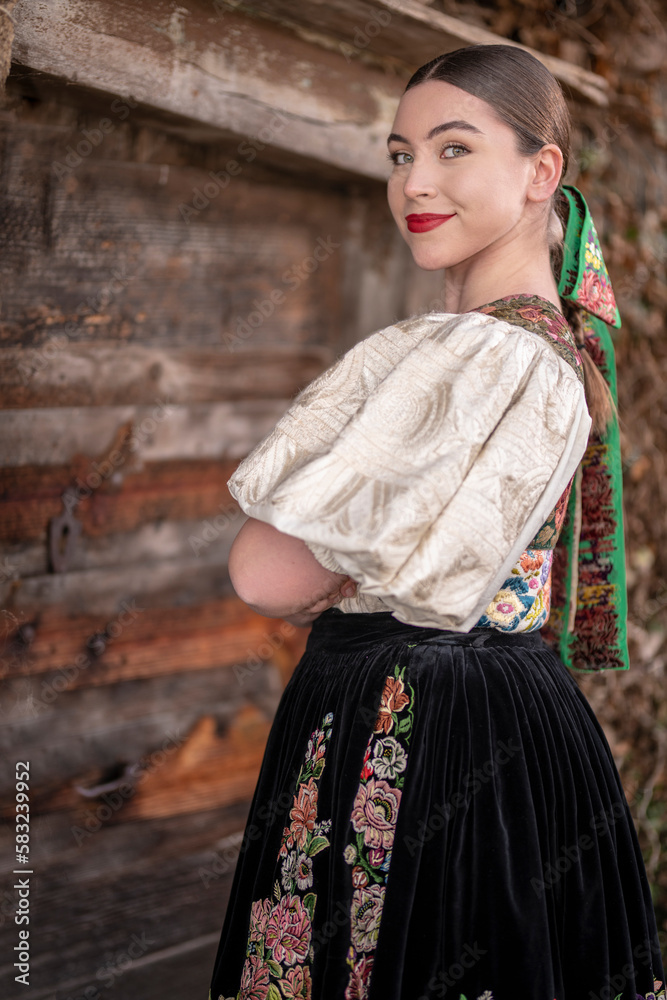 Young beautiful slovak woman in traditional dress. Slovak folklore