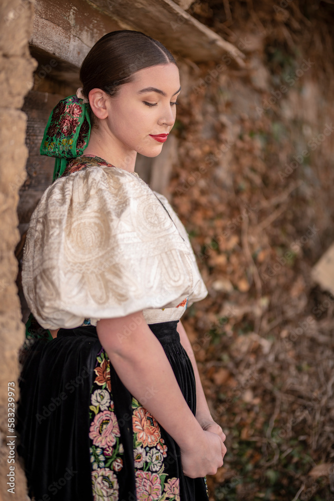 Young beautiful slovak woman in traditional dress. Slovak folklore