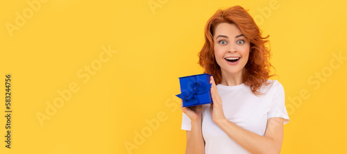 surprised lady with purchase box on yellow background  shopping. Woman isolated face portrait  banner with mock up copy space.