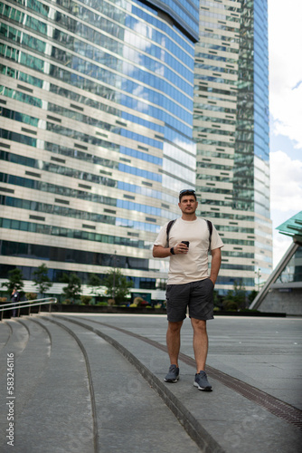 A man near high-rise buildings