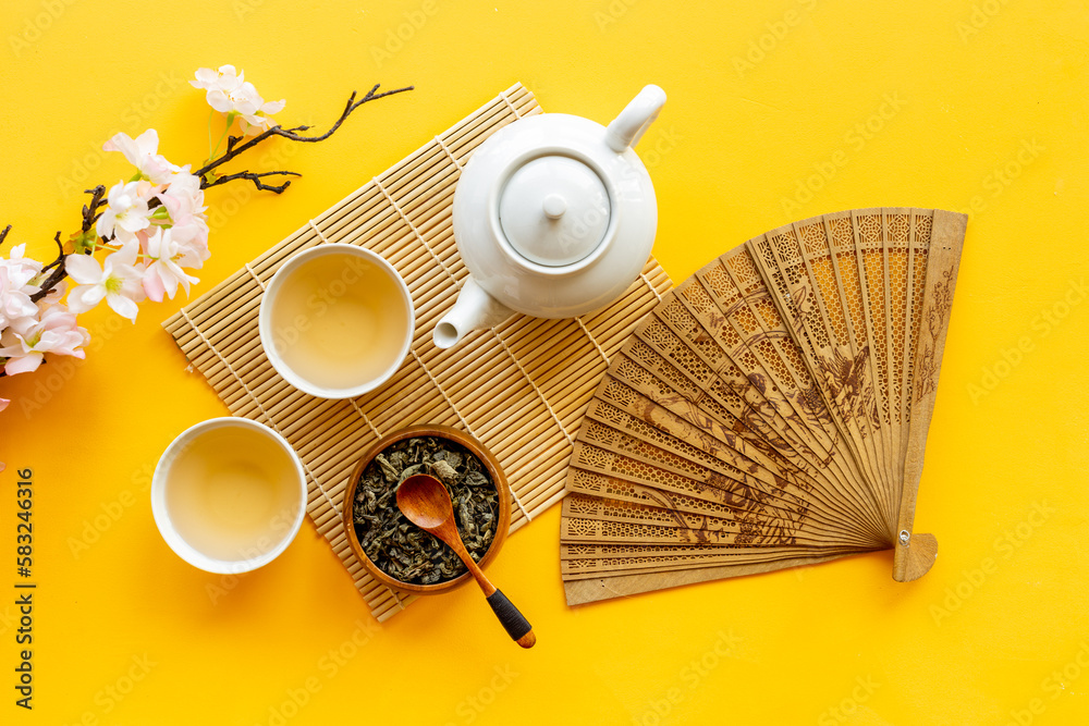 Japanese table setting with teapot and cups of tea