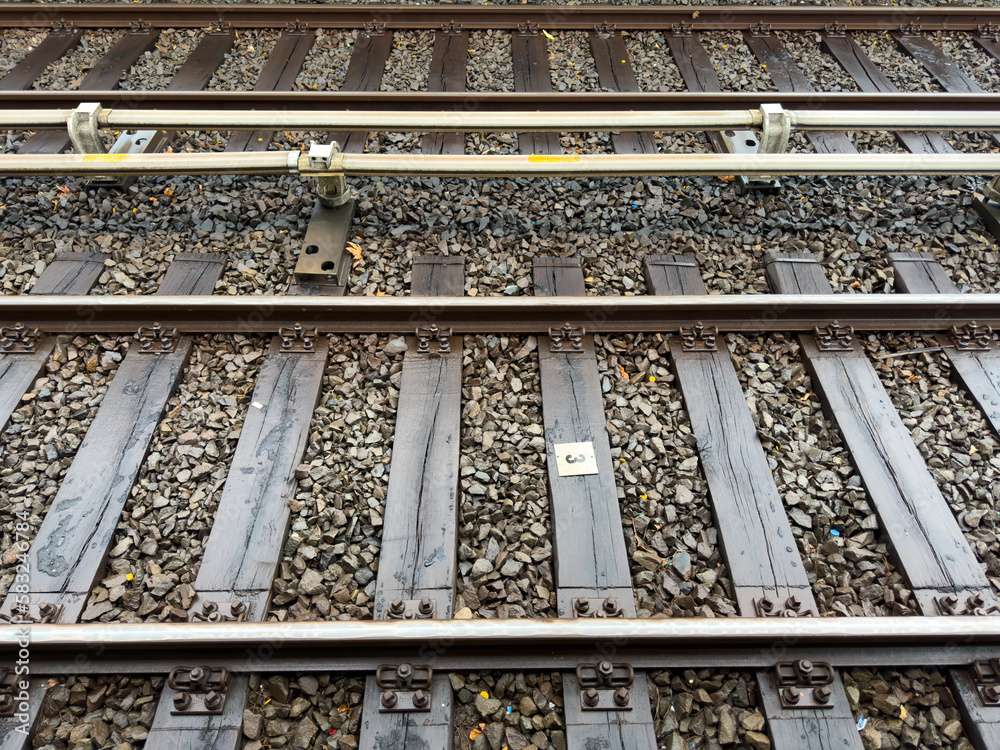 Wet railway on a rainy day. A close up shot of railroad tracks at daytime. Wet railway on a rainy day. A close up shot of railroad tracks at daytime.