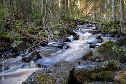 Stunning Frozen Hassafallen Waterfall in Wintry Rural Woodlands outside of Jonkoping Sweden And Nearby Taberg Stream. Sweden Rivers And Waterfalls Wintertime in nature reserve.