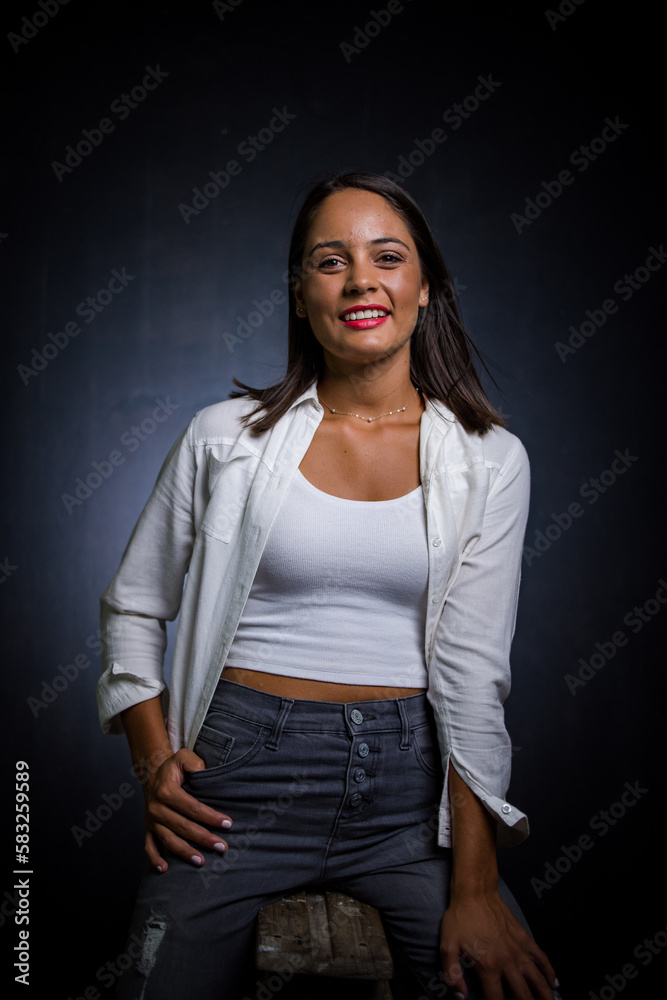 Close up image of a Dark Haired Girl Posing for a Fashion Shoot in a studio Close up image of a Dark Haired Girl Posing for a Fashion Shoot in a studio