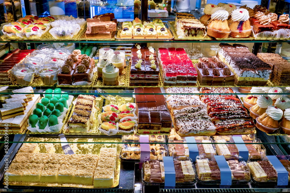 Showcase of different cakes in a confectionery shop