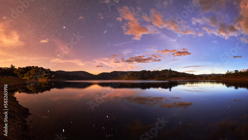 sunrise and stars over the lake
