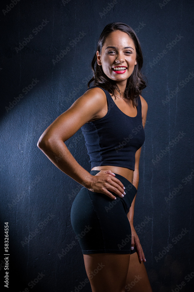 Close up image of a Dark Haired Girl Posing for a Fitness Photo shoot Close up image of a Dark Haired Girl Posing for a Fitness Photo shoot