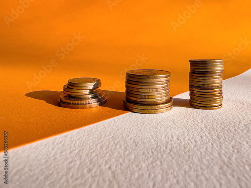 stacks of coins. golden stacks of coins in ascending order