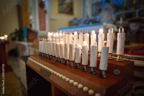 Modern electronic candles in the church.