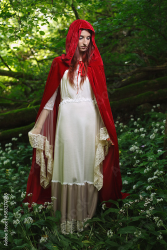 Red riding hood in a green forest
