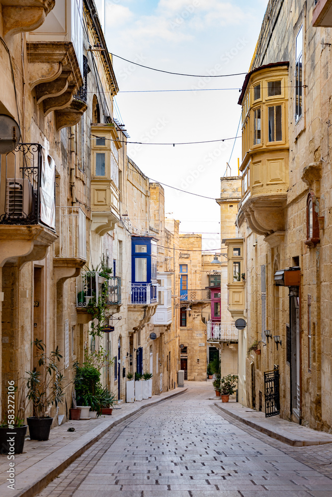 Calm street with traditional Maltese balconies in Vittoriosa (Birgu), Three Cities, Malta