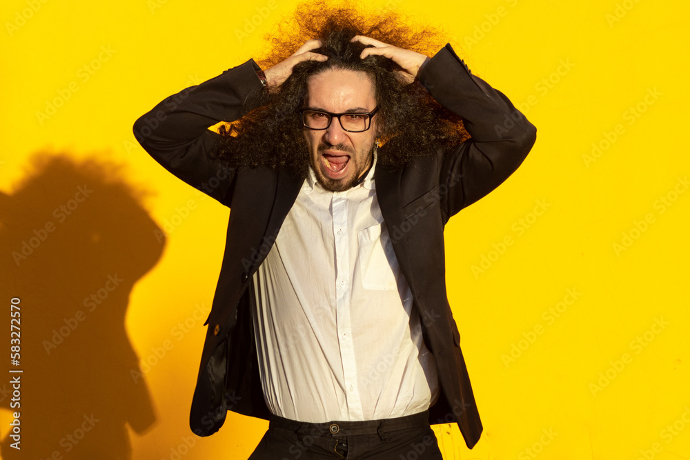 portrait of businessman shouting. headshot of desperate businessman over yellow background portrait of businessman shouting. headshot of desperate businessman over yellow background