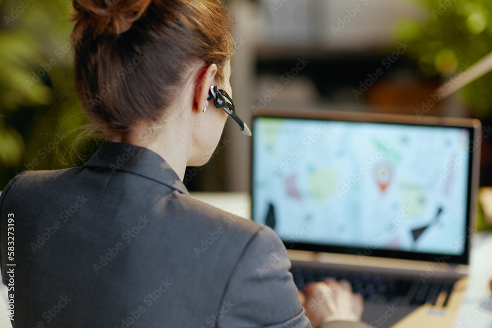 Closeup on modern business woman with laptop and headset Closeup on modern business woman with laptop and headset