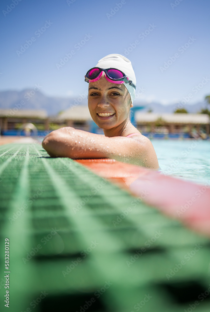 Close up image of a Female Swimmer in Action at a Tournament swimming Pool