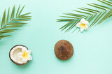 Tropical background with coconut and palm leaves.