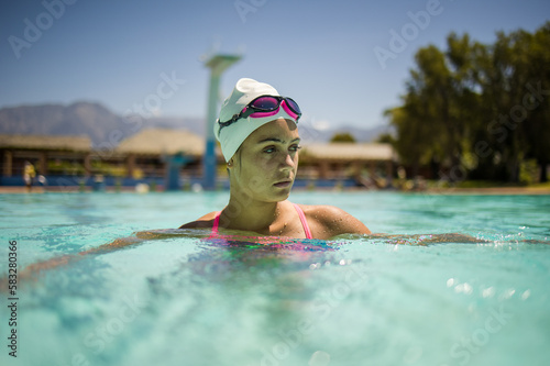 Close up image of a Female Swimmer in Action at a Tournament swimming Pool