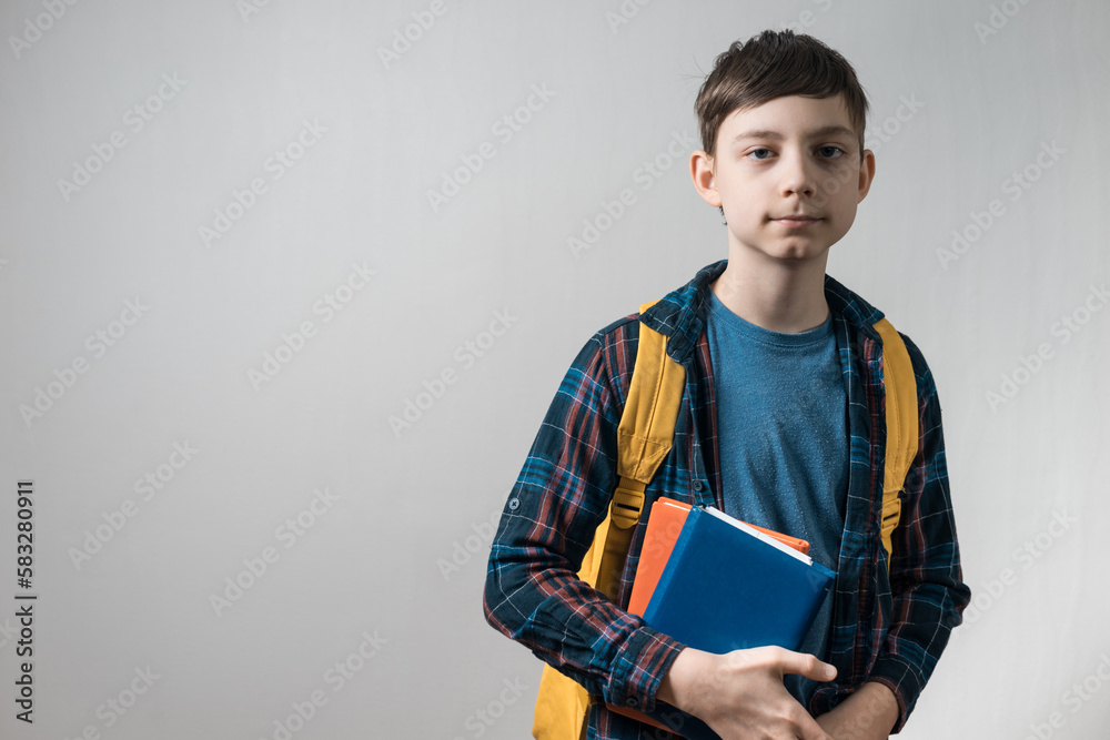 kid pupil in casual clothes with school bag and books kid pupil in casual clothes with school bag and books