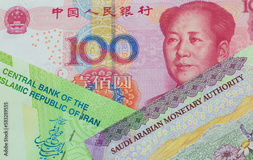 A Chinese Yuan Bank Note with Money From Suadi Arabia and Iran photo