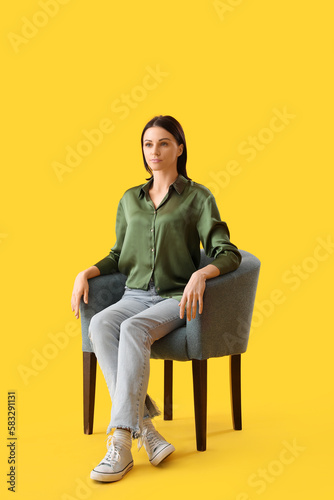 Beautiful woman sitting in ...