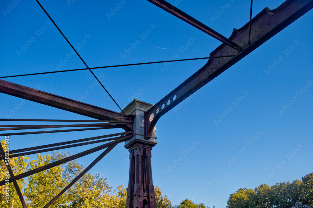 Unusual bridge of steel and wood shining under the evening sun, Laurel, MD, USA
