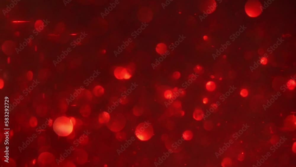 Red bokeh abstract background. Floating Red defocused particles as a festive motion background. Bokeh lights. Blur Red glitter.