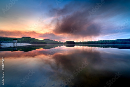 Sunrise on Son Tho lake. This lake belongs to Son Tho village, Son Tra town, Hue city. This place is about 20 km from the city center. This is a favorite camping spot for young people photo