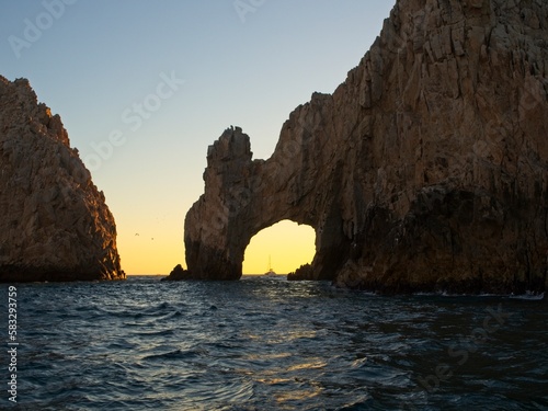 The sun sets on the Pacific side of Cabo San Lucas, with the glow making almost a silhouette out of the Arch of Cabo San Lucas