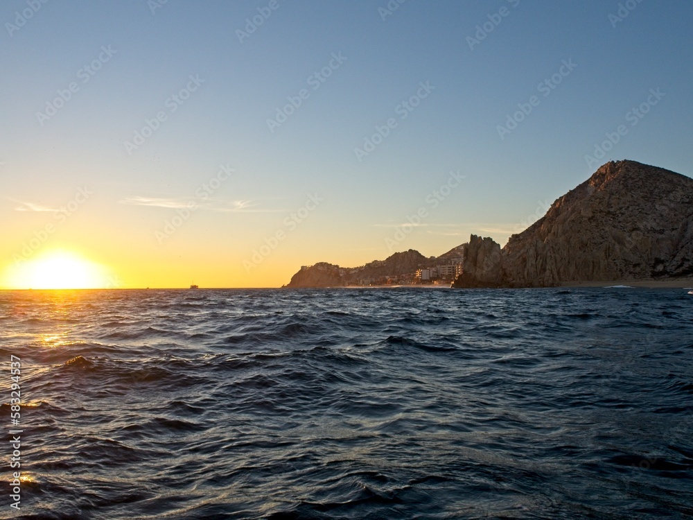 The sun sets over the Pacific Ocean as we sail around the end of the Baja California Peninsula near Cabo San Lucas