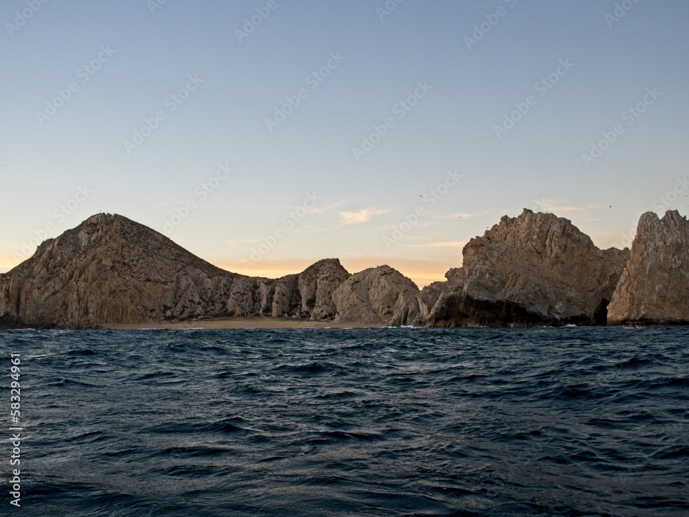 Strong waves crash against the rocks lining the coast of Baja California Sur Strong waves crash against the rocks lining the coast of Baja California Sur
