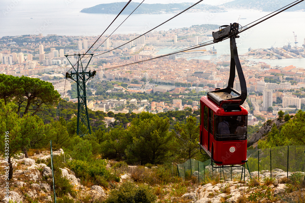Photo of cable car to Mount Faron, view of French city Toulon in background.