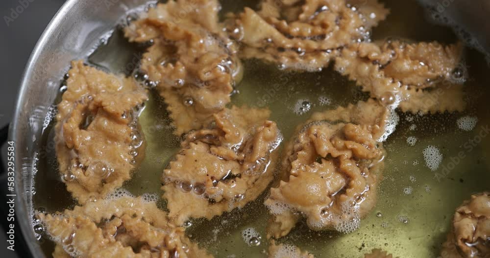 The delicious sizzle of chebakia in the pan—a sensory experience that precedes the sweetness of the final stage The delicious sizzle of chebakia in the pan—a sensory experience that precedes the sweetness of the final stage