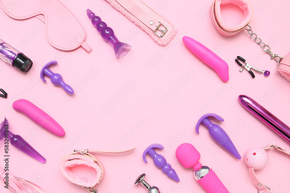 Frame made of sex toys on pink background Frame made of sex toys on pink background
