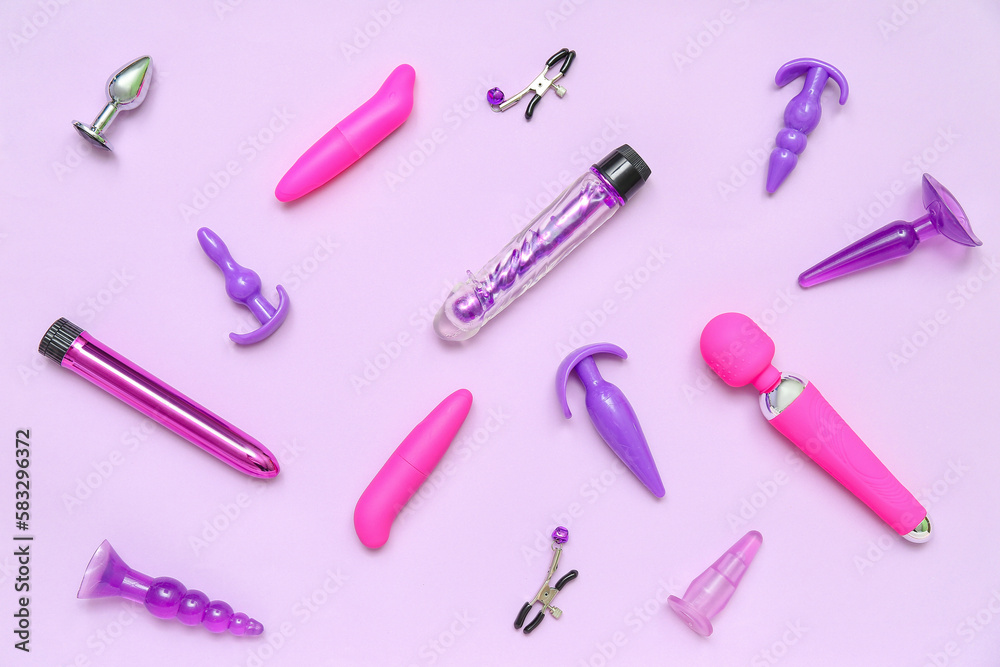 Different sex toys on lilac background Different sex toys on lilac background