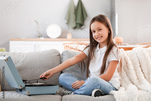 Little girl with record pla...