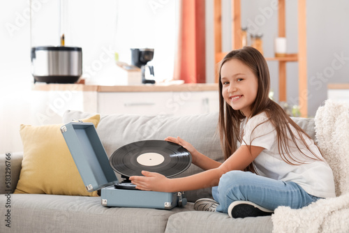 Little girl with vinyl disc...