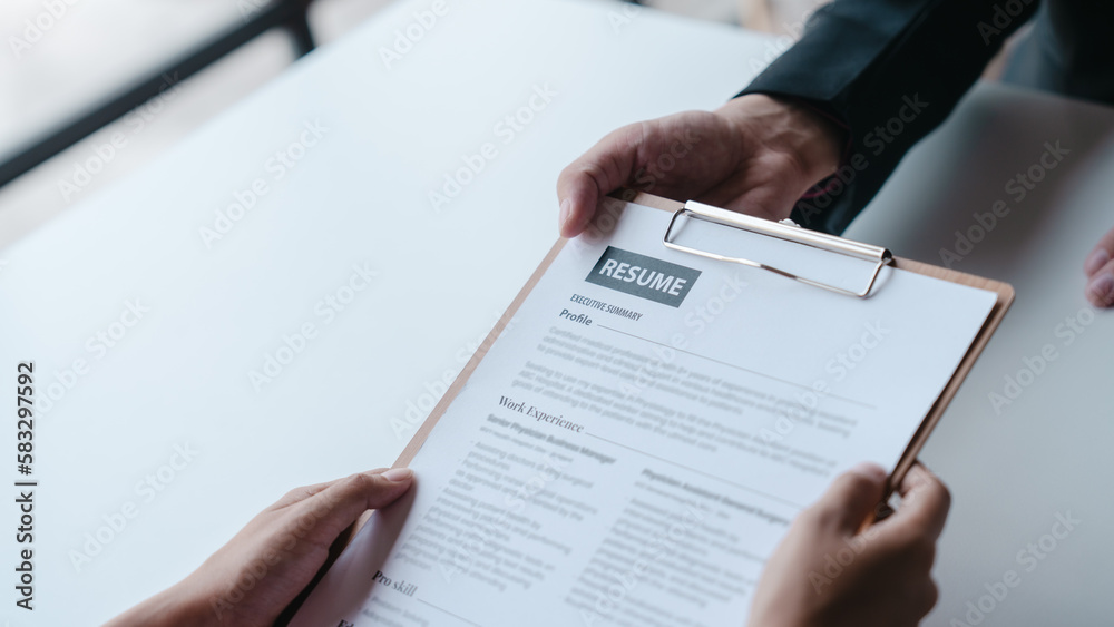 Close up view of job interview with applicant with resume paper in office, Recruitment, Job application concept. Close up view of job interview with applicant with resume paper in office, Recruitment, Job application concept.