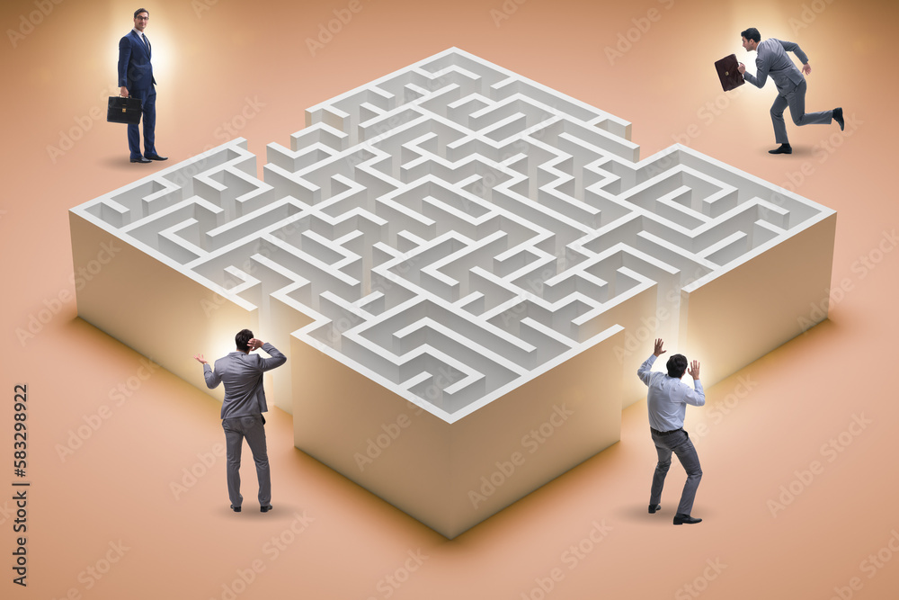 Businessman trying to find a way out of maze Businessman trying to find a way out of maze