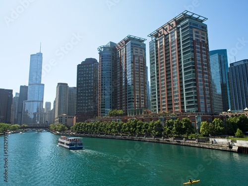 High rises loom above the Chicago River, forming a man-made canyon of buildings