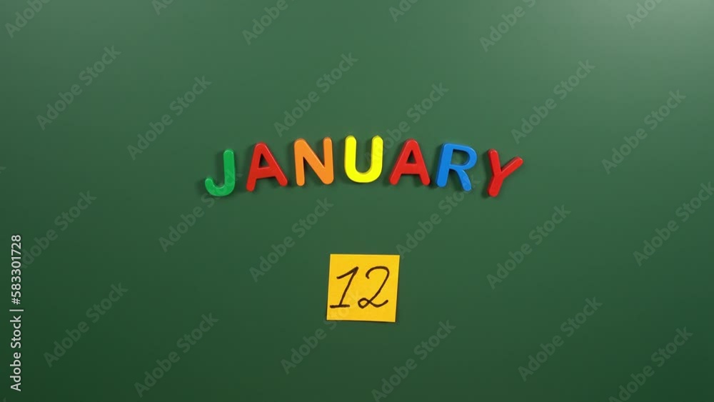 Hand sticking a sticker 12 January calendar day on school board. 12 date of January. Twelfth day of January. 12th date number. 12 day calendar. Twelve date Hand sticking a sticker 12 January calendar day on school board. 12 date of January. Twelfth day of January. 12th date number. 12 day calendar. Twelve date