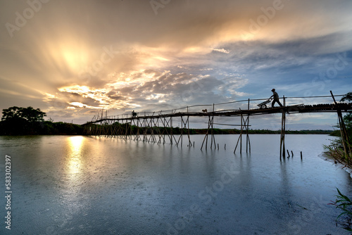 Farmers go to work on a bridge made of bamboo at Cam Dong village  Quang Nam province  Vietnam