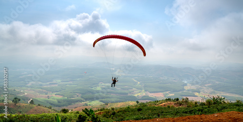 Paragliding on Chu Tan Kra mountain peak in Sa Thay district, Kon Tum province, Vietnam 