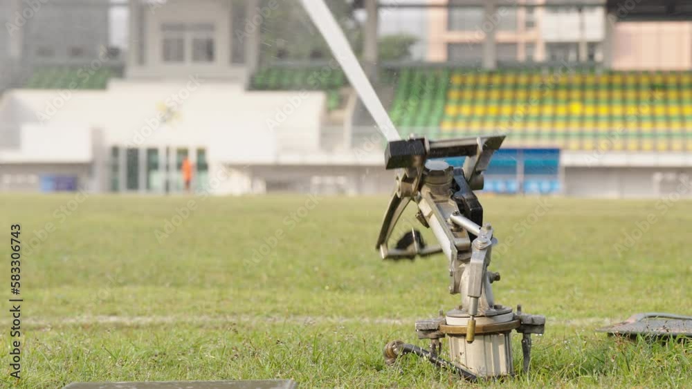 Slow Motion of Grass sprinkler on football field Soccer arena watering irrigation Slow Motion of Grass sprinkler on football field Soccer arena watering irrigation