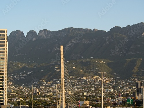 La Eme (the M) is a notable part of the Cerro de Chipinque, a mountain that rises to over 7,000 feet in elevation above the Mexican city of Monterrey, with the Puente de la Unidad in the foreground photo