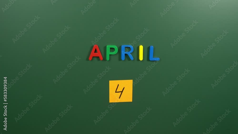Hand sticking a sticker 4 April calendar day on school board. 4 date of April. Fourth day of April. 4th date number. 4 day calendar. Four date. Senegal Independence Hand sticking a sticker 4 April calendar day on school board. 4 date of April. Fourth day of April. 4th date number. 4 day calendar. Four date. Senegal Independence