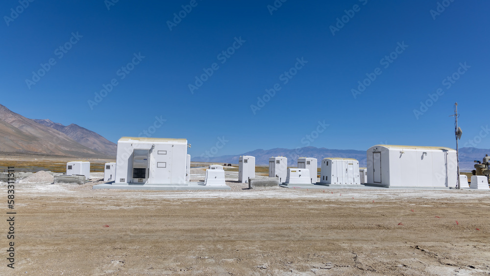 Modern pumping station at Owens lake in California against blue sky. Modern pumping station at Owens lake in California against blue sky.