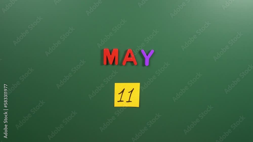 Hand sticking a sticker 11 May calendar day on school board. 11 date of May. Eleventh day of May. 11th date number. 11 day calendar. Eleven date. National Foam Rolling Hand sticking a sticker 11 May calendar day on school board. 11 date of May. Eleventh day of May. 11th date number. 11 day calendar. Eleven date. National Foam Rolling