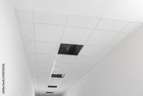 Wallpaper Mural Low angle view on PVC tiles. Installing ceiling lighting Torontodigital.ca