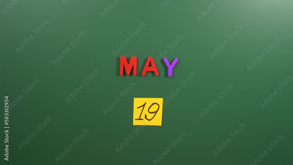 Hand sticking a sticker 19 May calendar day on school board. 19 date of May. Nineteenth day of May. 19th date number. 19 day calendar. Nineteen date Hand sticking a sticker 19 May calendar day on school board. 19 date of May. Nineteenth day of May. 19th date number. 19 day calendar. Nineteen date