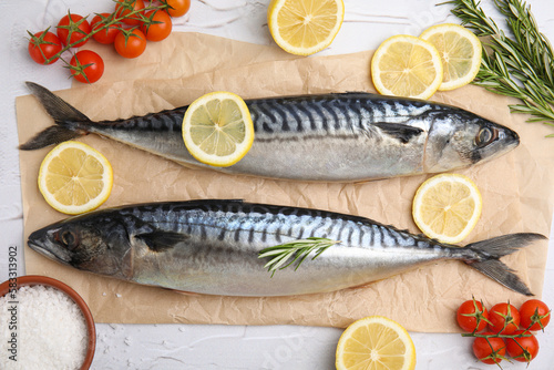 Flat lay composition with tasty raw mackerel on white textured table