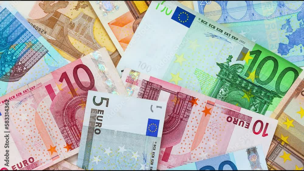 Flat lay of Euro banknotes of different denominations. Financial business background. Concept of payment for services, market relations, tax, loans, economy, inflation. Top view, close-up Flat lay of Euro banknotes of different denominations. Financial business background. Concept of payment for services, market relations, tax, loans, economy, inflation. Top view, close-up